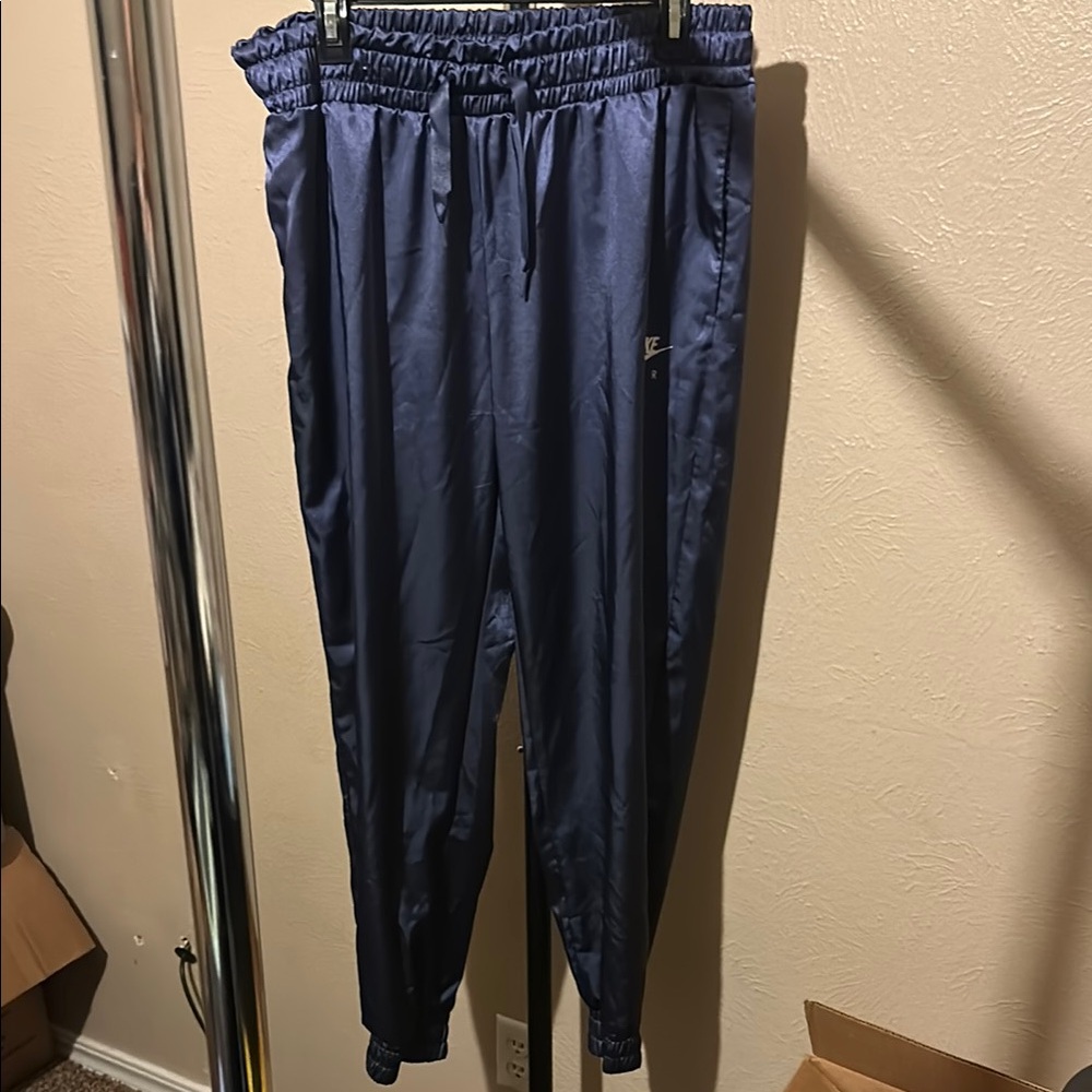 Nike women’s metallic track pants